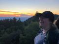 Brieanne Forbes smiling in front of a sunset