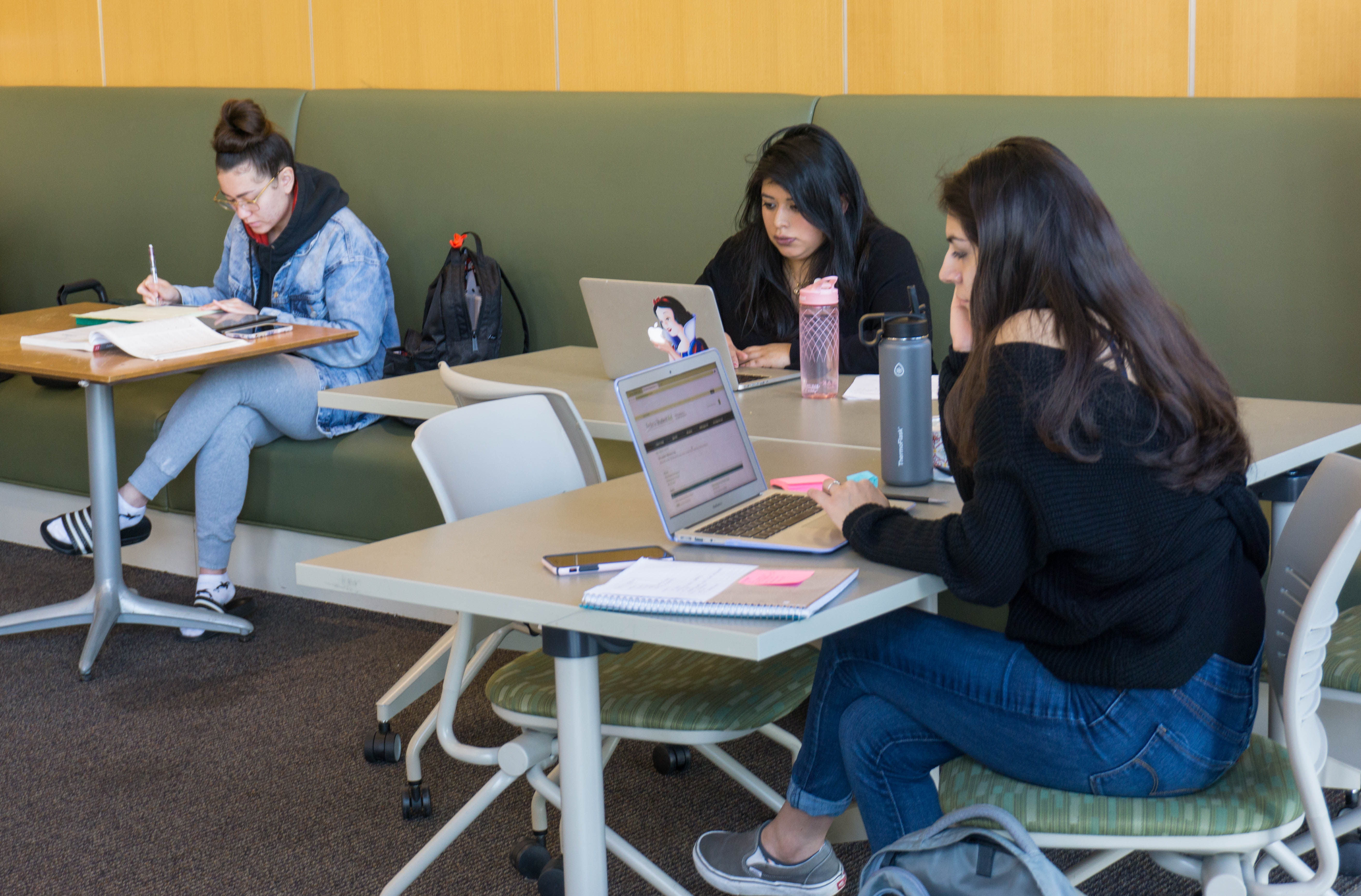 Students studying at tables in the Darwin Lobby