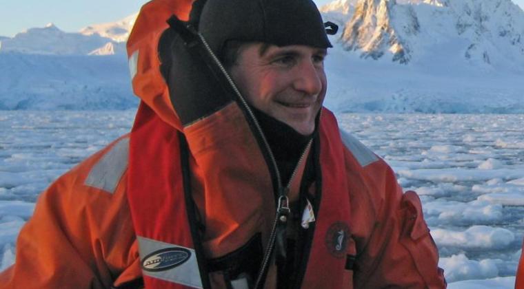 Professor Dan Crocker in diving gear in on icy water